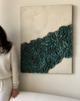 Minimalist 3D textured fabric wall art hung vertically above wooden console table in foyer