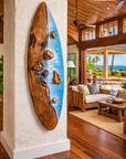 Handcrafted wood and resin surfboard wall art with blue ocean waves
