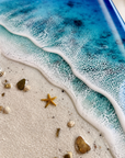 Resin beach artwork with shells stones and starfish