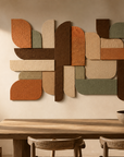 Warm accent spotlight casting deep architectural shadows along 3D geometric relief steps